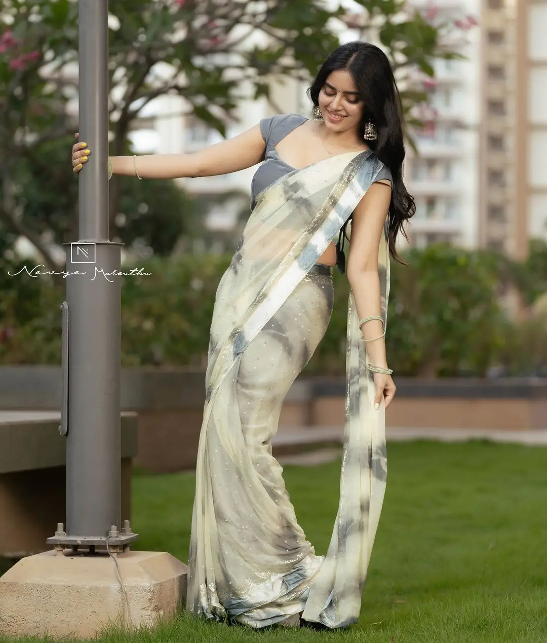 Navya Marouthu Wearing White Saree Sleeveless Black Blouse